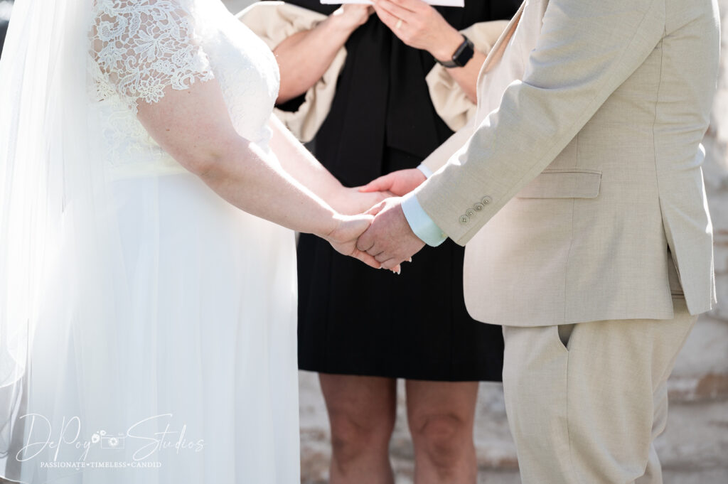 Newlyweds celebrating with family at their Scottsdale elopement by Scottsdale elopement photographer, DePoy Studios.