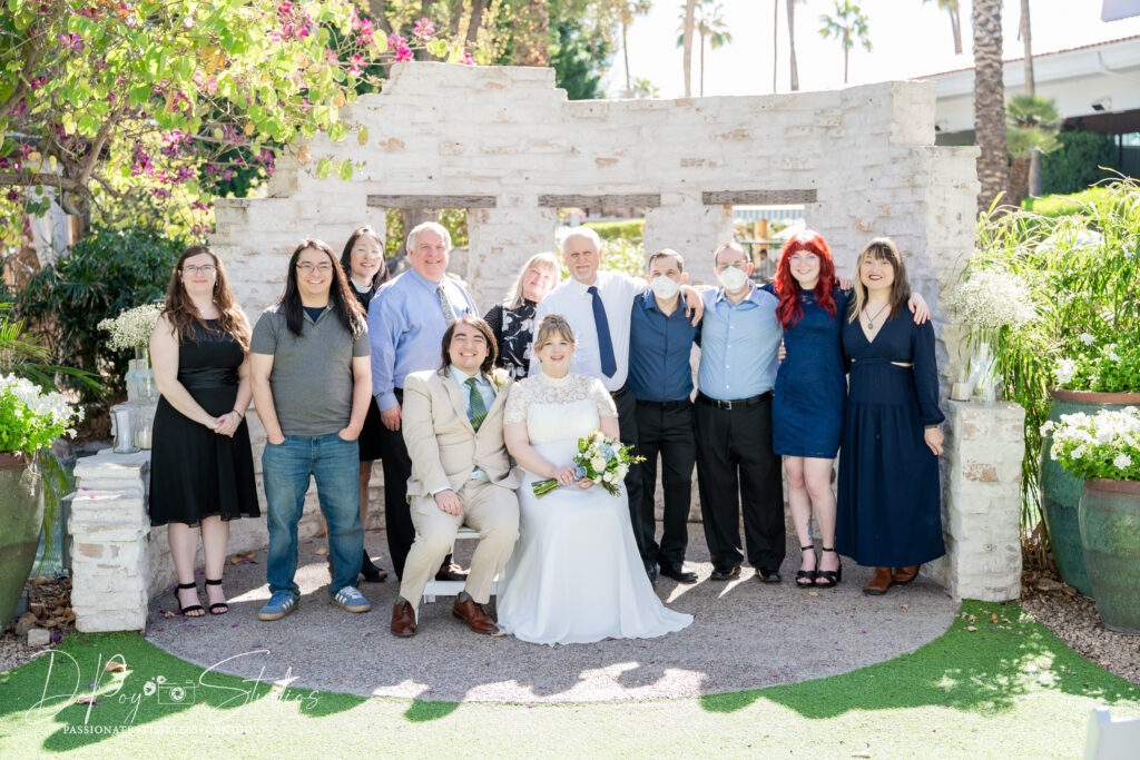 Newlyweds celebrating with family at their Scottsdale elopement at The Scott Resort and Spa by DePoy Studios. Scottsdale elopement photographer.