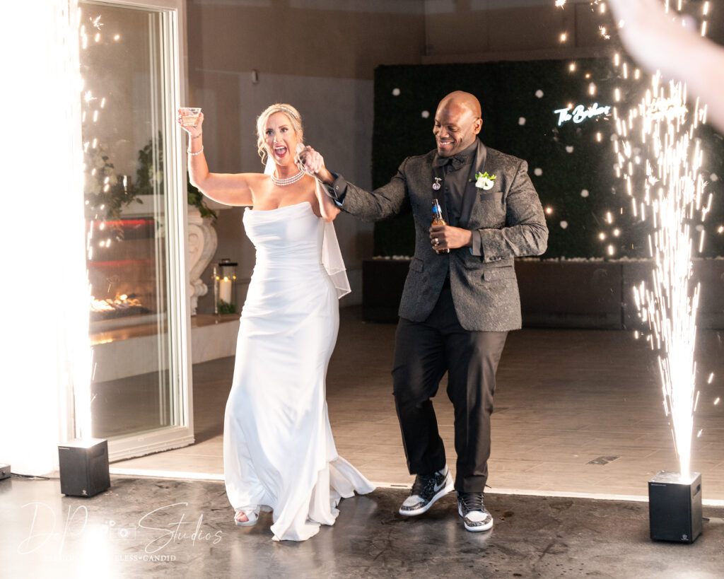 Wedding guests laughing and dancing at SoHo63 in Chandler, Arizona.