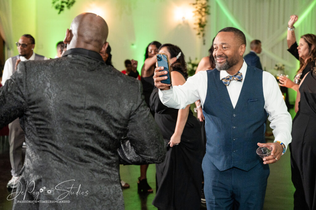 Guests having fun on the dance floor at a SoHo63 wedding reception.