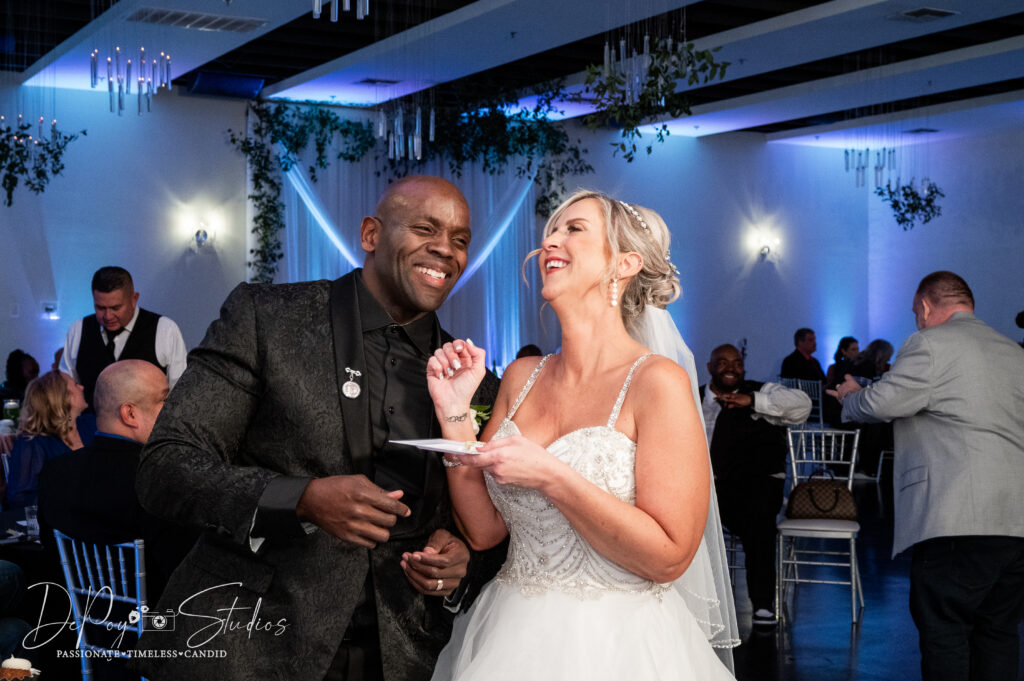 Bride and groom sharing a bite of their wedding cake at SoHo63 in Arizona.