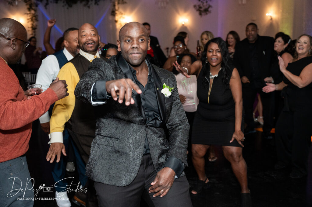 Wedding guests laughing and dancing at SoHo63 in Chandler, Arizona.