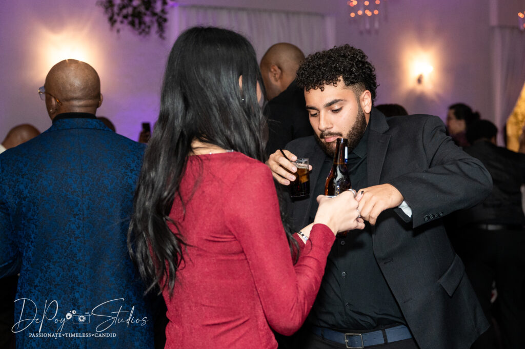 Wedding guests laughing and dancing at SoHo63 in Chandler, Arizona.