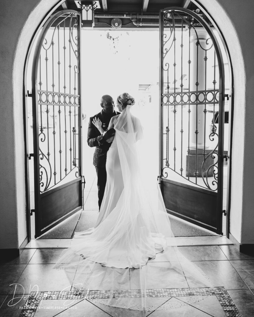 Romantic black and white photo of an interracial couple at SoHo63, captured by a Chandler wedding photographer.